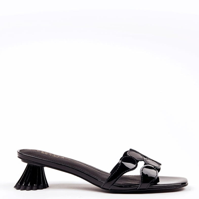 Black patent leather kitten heel sandal with circle toe strap and a distinctive heel design.