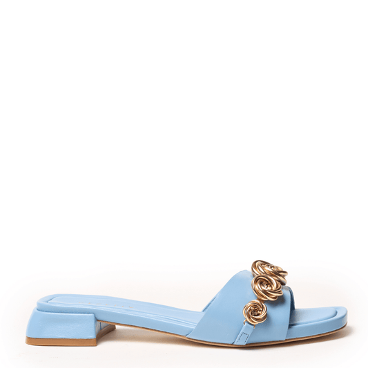Soft blue sandal with gold rosette metal charms