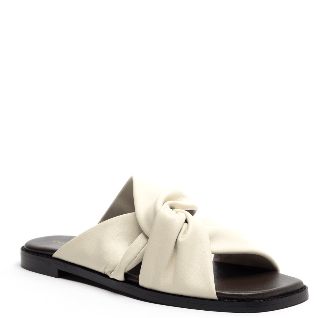 Square toed ivory flat sandal with padded footbed 