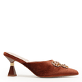 A single brown velvet mule high heel shoe with a decorative jeweled brooch on the toe and a geometric brown block heel, shown against a plain white background.