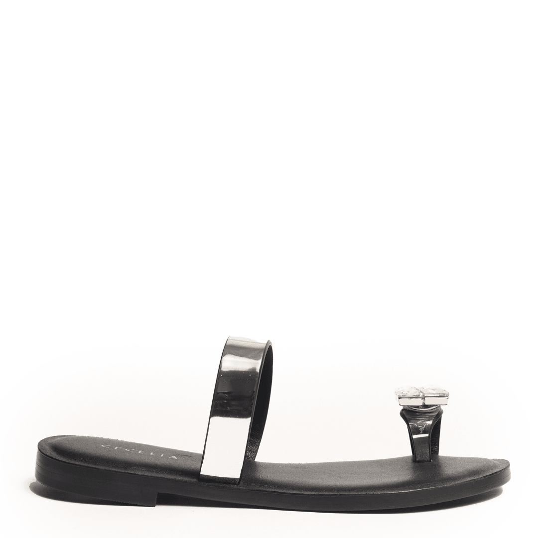 Black sandal with metallic silver strap and embellished toe detail