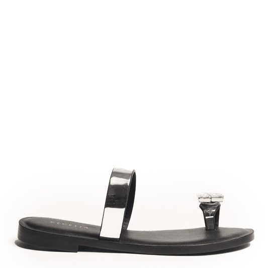 Black sandal with metallic silver strap and embellished toe detail