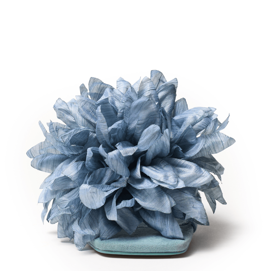 Square toe footbed in blue with oversized flower slide sandal