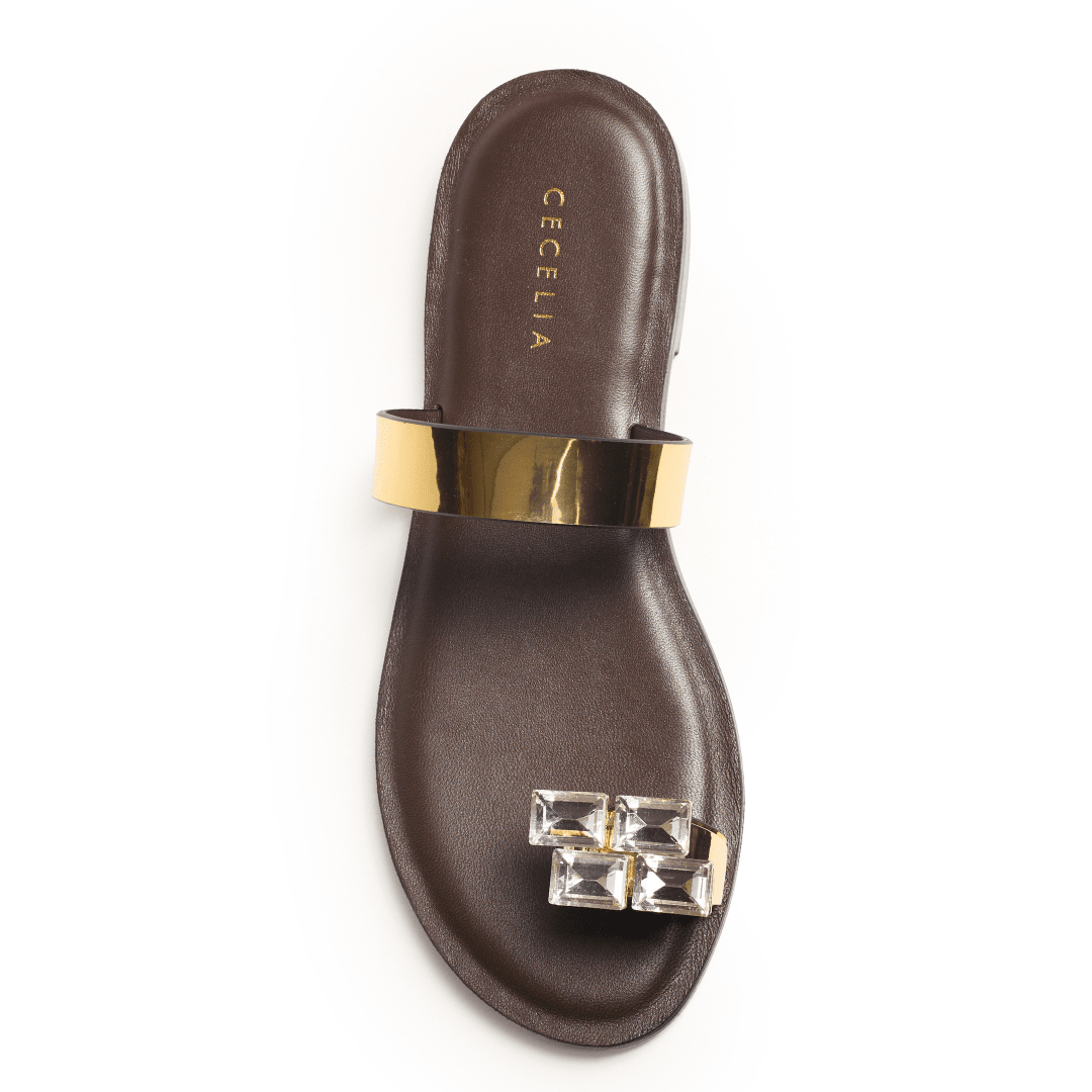 Brown sandal with gold strap and gemstone detail 