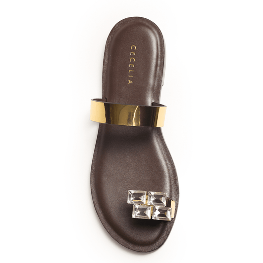 Brown sandal with gold strap and gemstone detail 