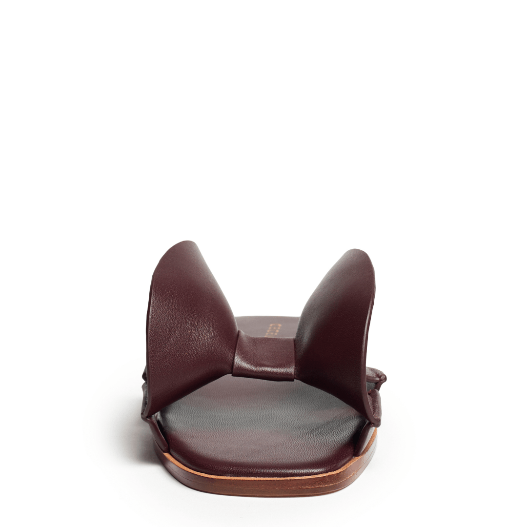 Brown leather headrest on a white background