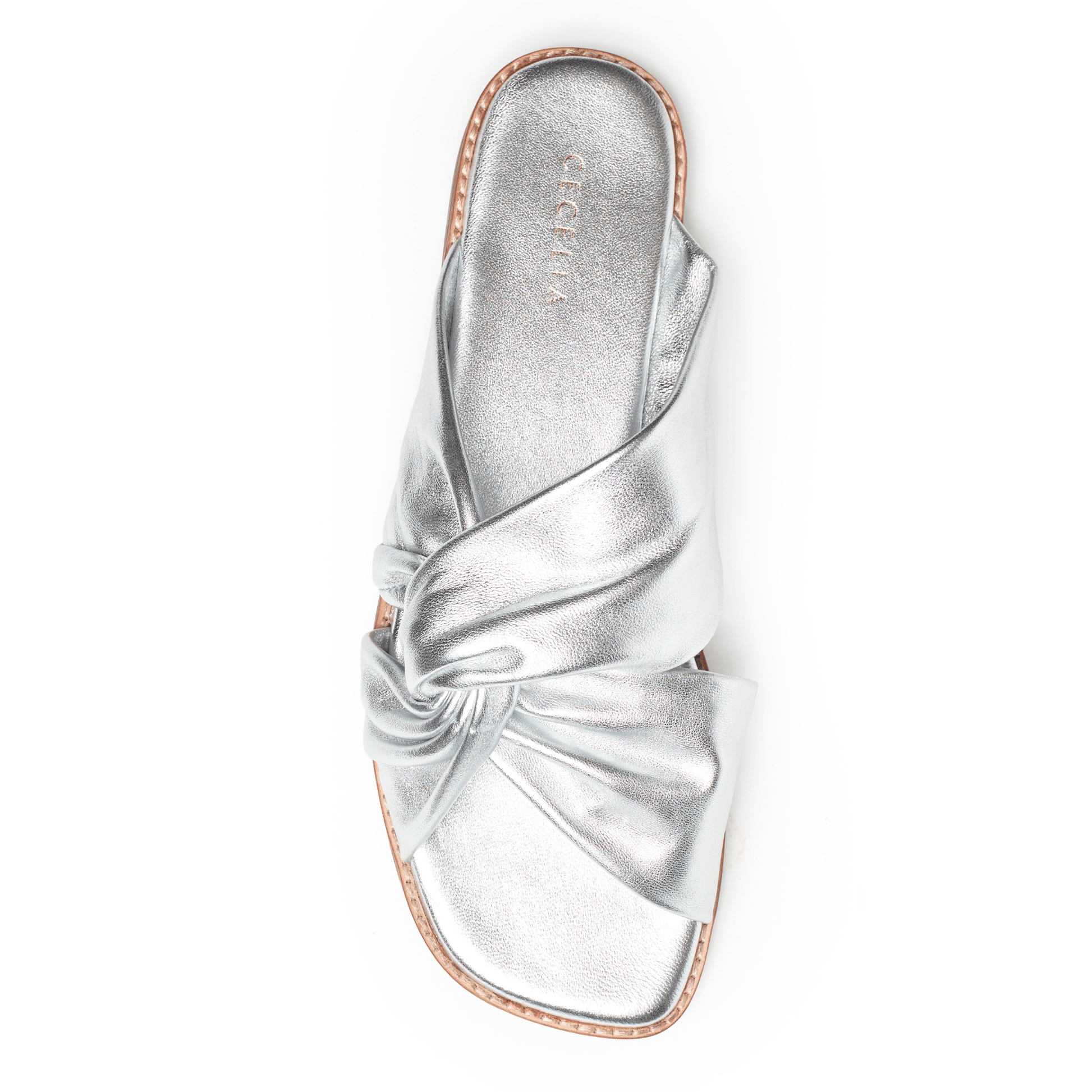 Soft Silver leather sandal with a bow on a white background