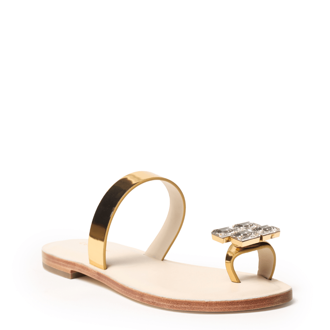 Gold sandal with a decorative crystal toe ring 