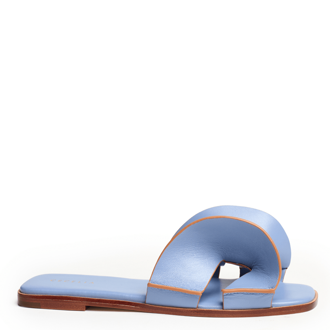 Robins Egg Blue sandal with brown sole on a white background